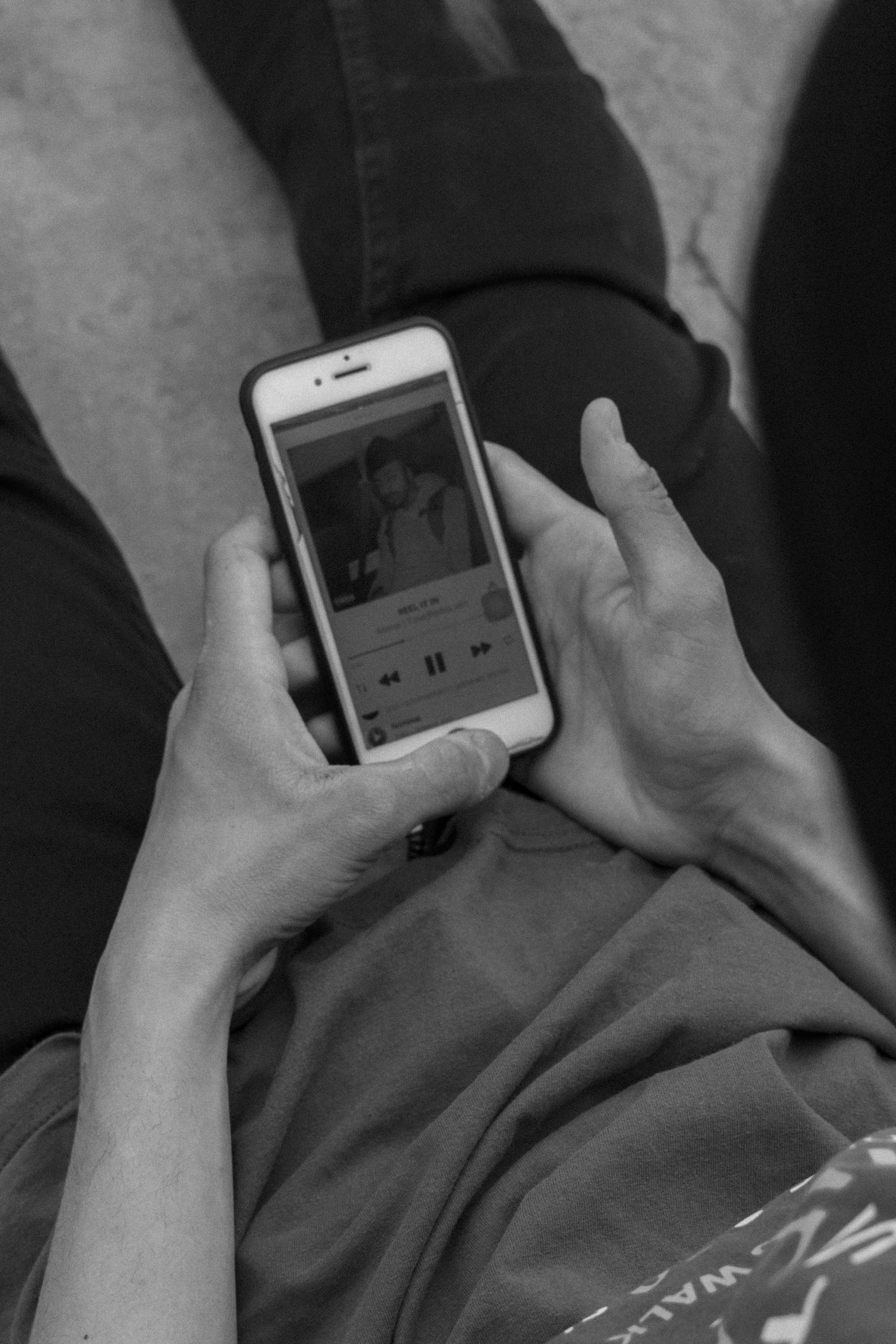 a person holding a smart phone in their hands