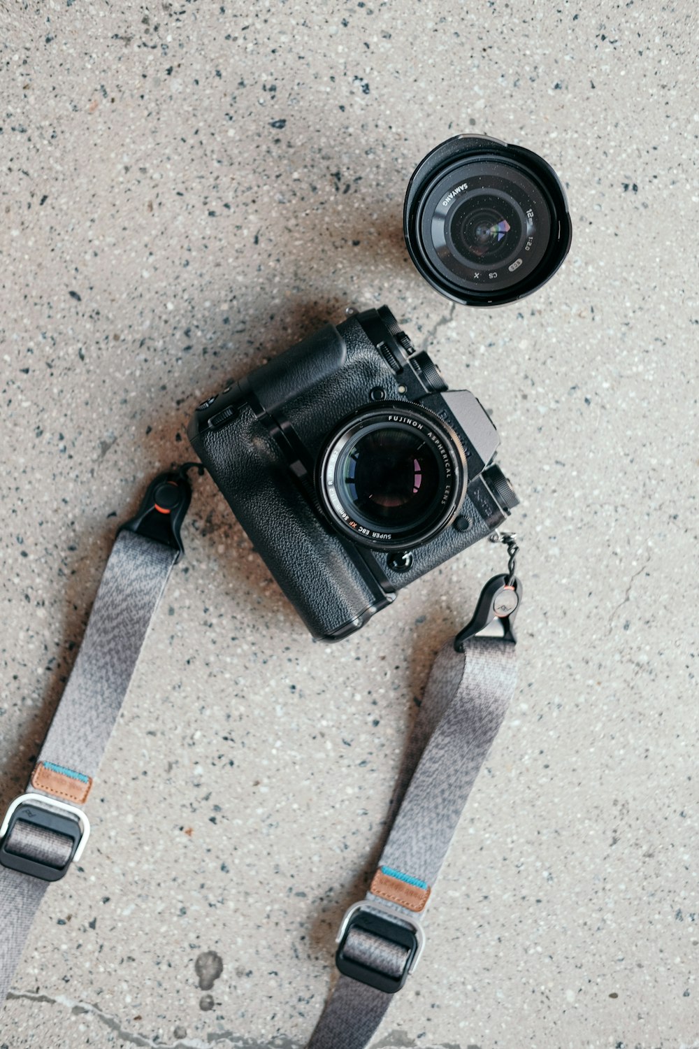 a camera sitting on top of a camera strap