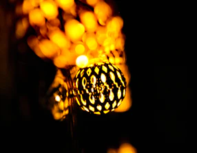 An elegant 3D printed decorative object displayed with warm ambient light.