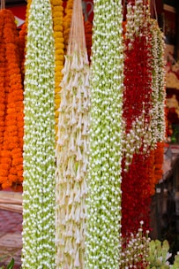 A vibrant close-up of traditional Tamil Nadu flowers arranged in a colorful pattern.