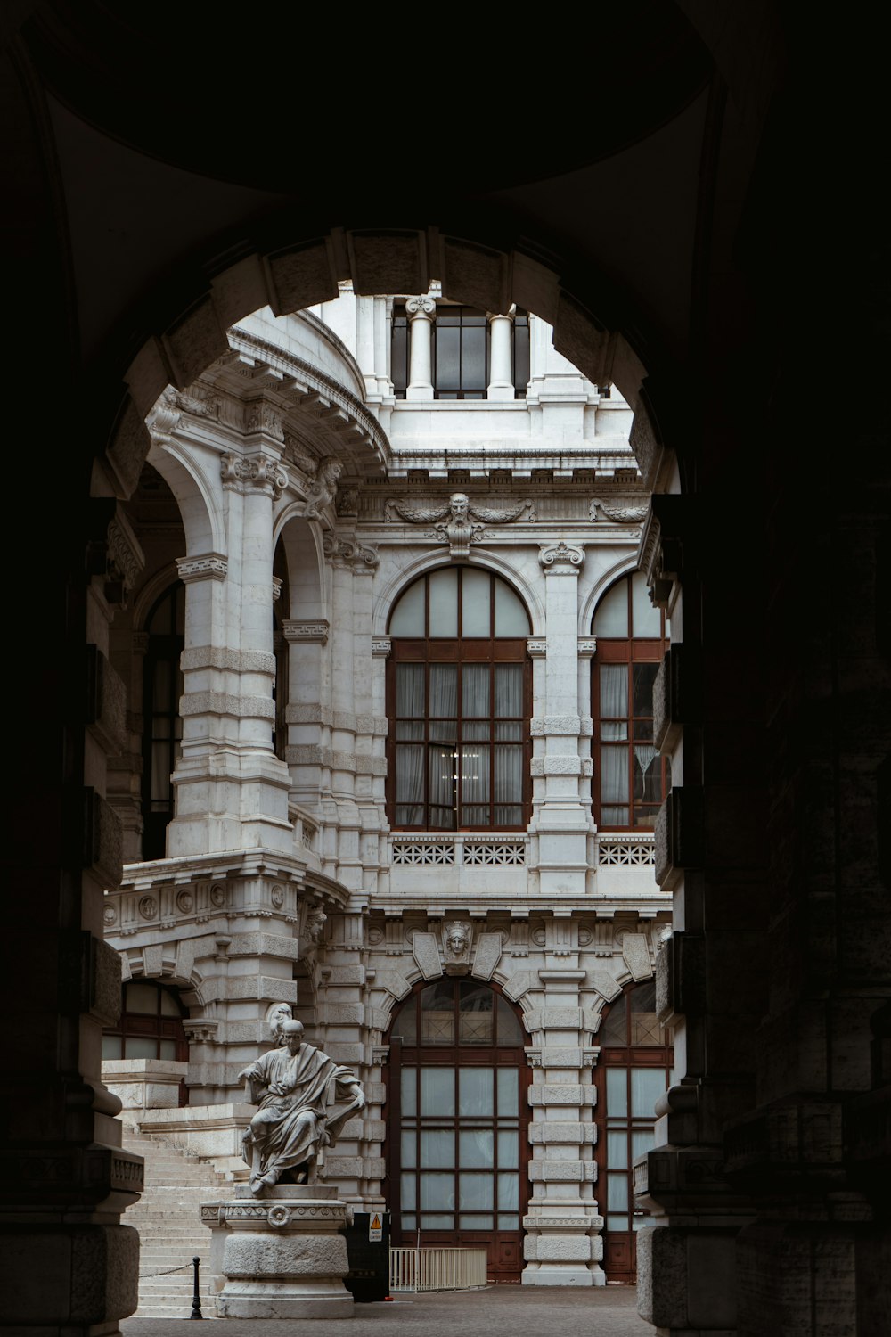 a large building with a statue in front of it