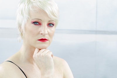 Shiny, healthy-looking platinum hair styled in loose waves.