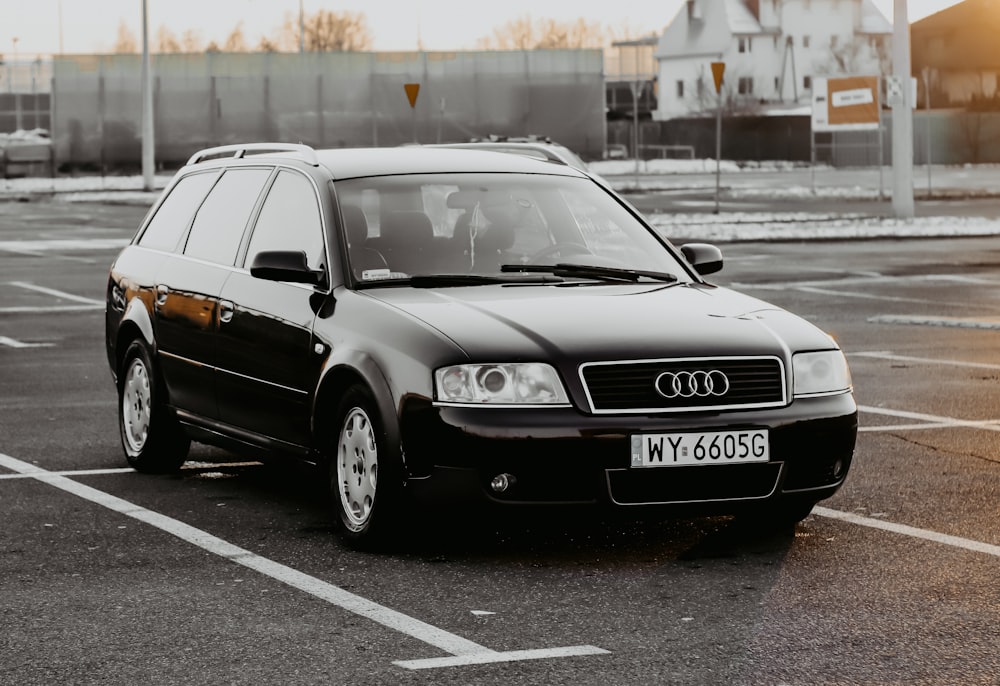 a black car parked in a parking lot