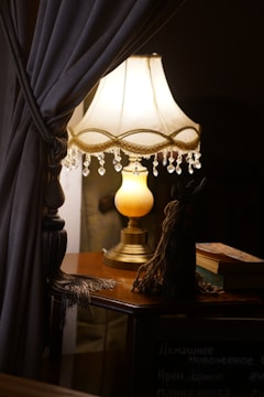 An elegant lamp placed on a wooden table.