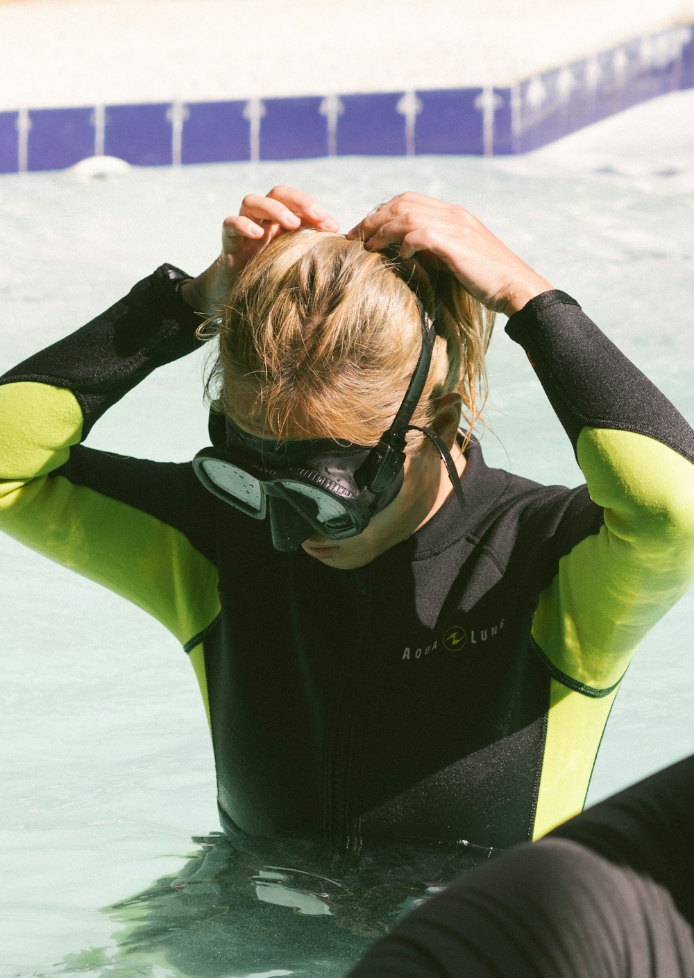 a person in a wet suit in the water
