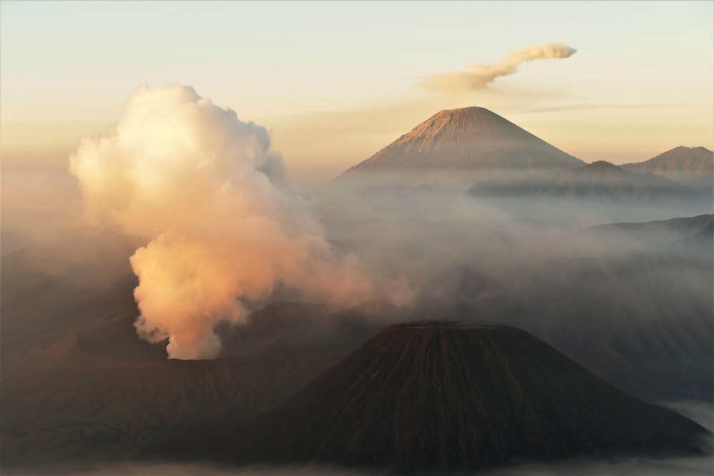 a mountain covered in a cloud of smoke