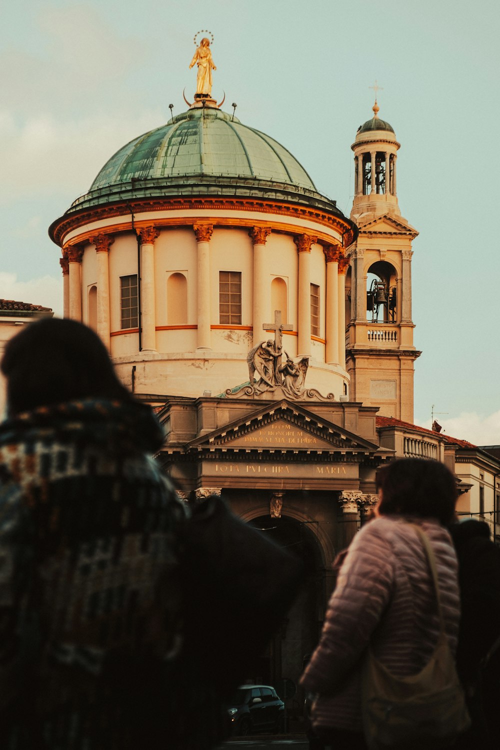 a group of people standing in front of a building