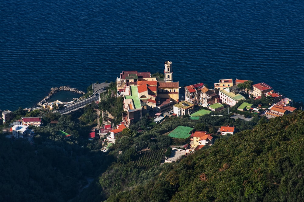 an aerial view of a small village on a hill