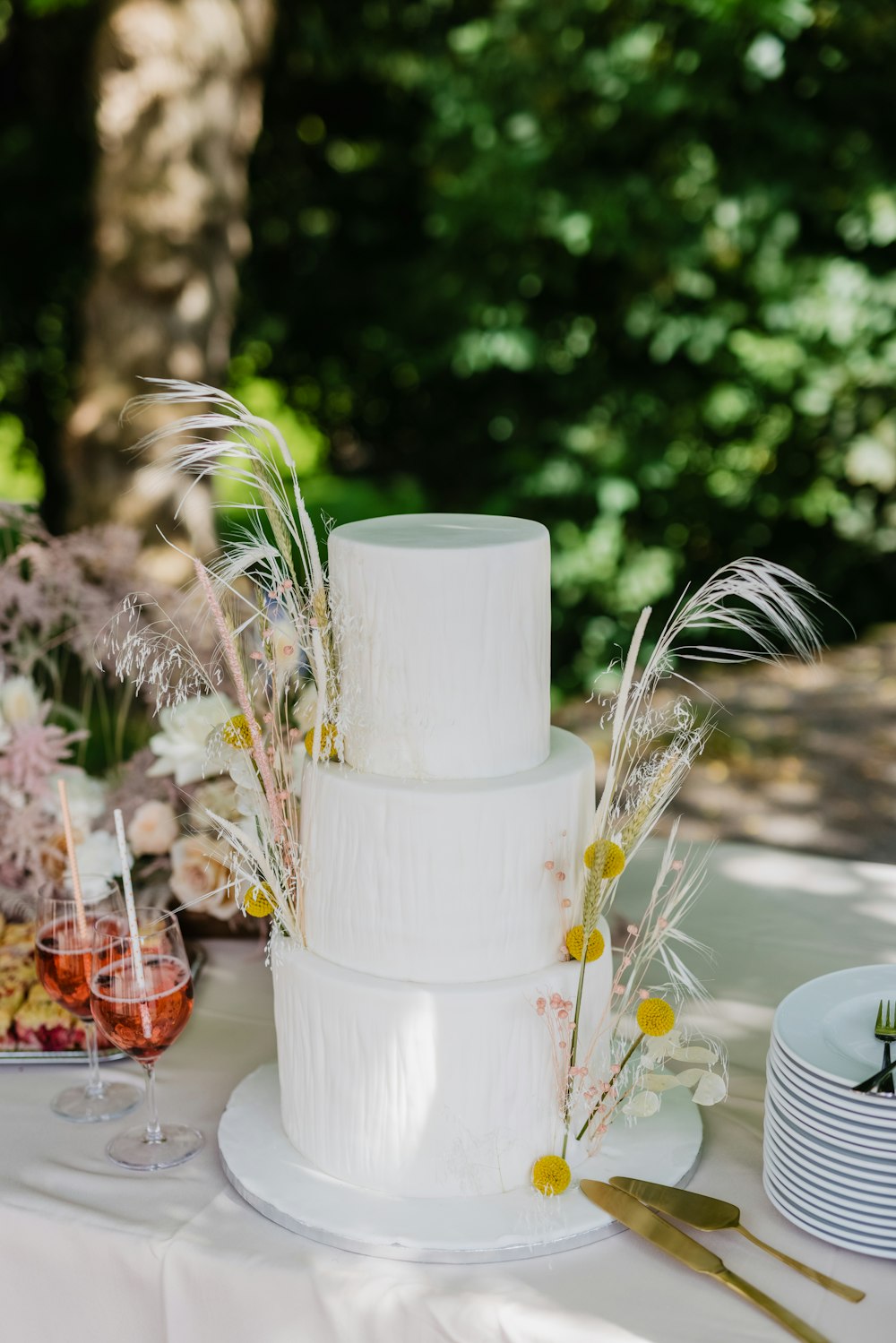 a white wedding cake sitting on top of a table