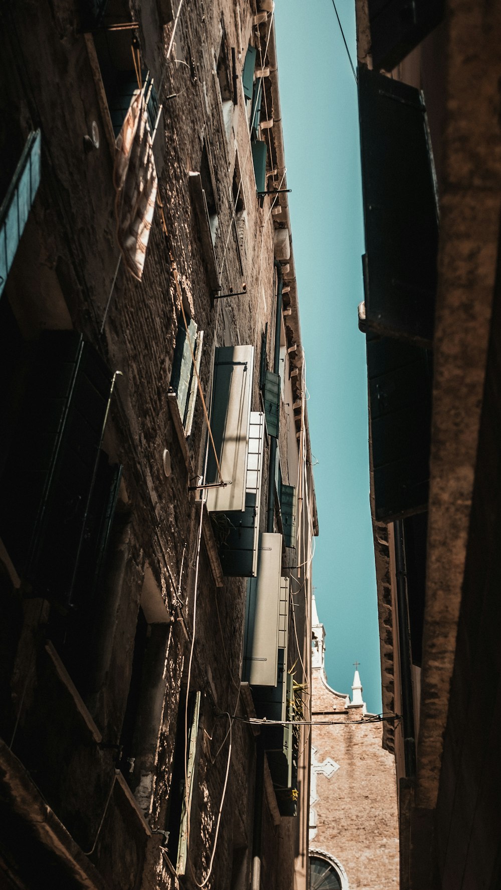 a tall building with a clock tower in the background