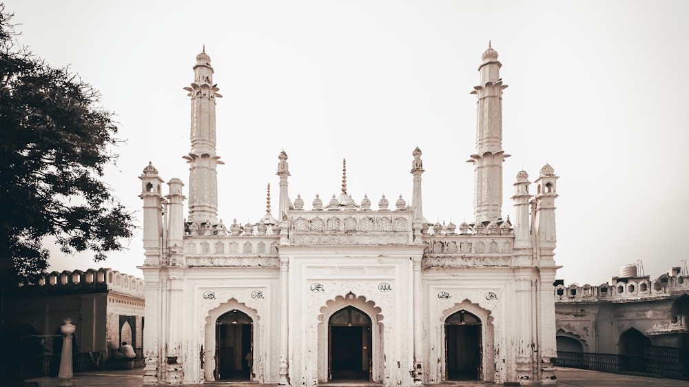 a large white building with two towers on top of it