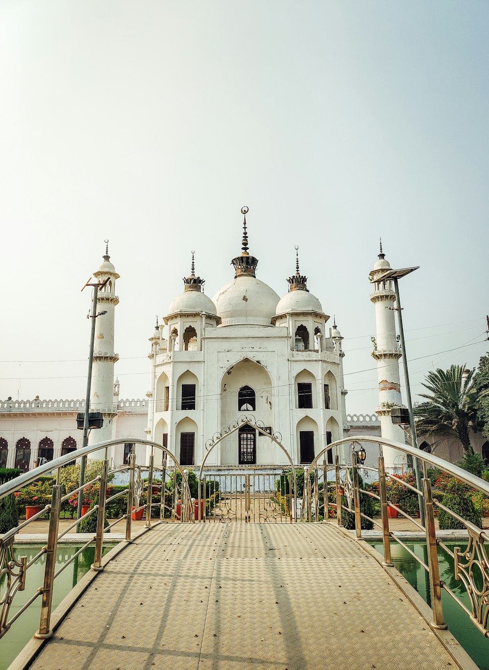 a large white building with two towers on top of it