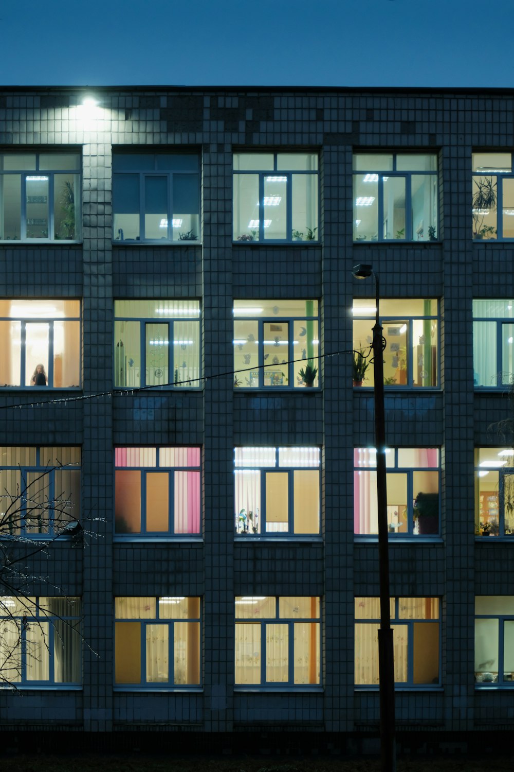 a building with many windows lit up at night