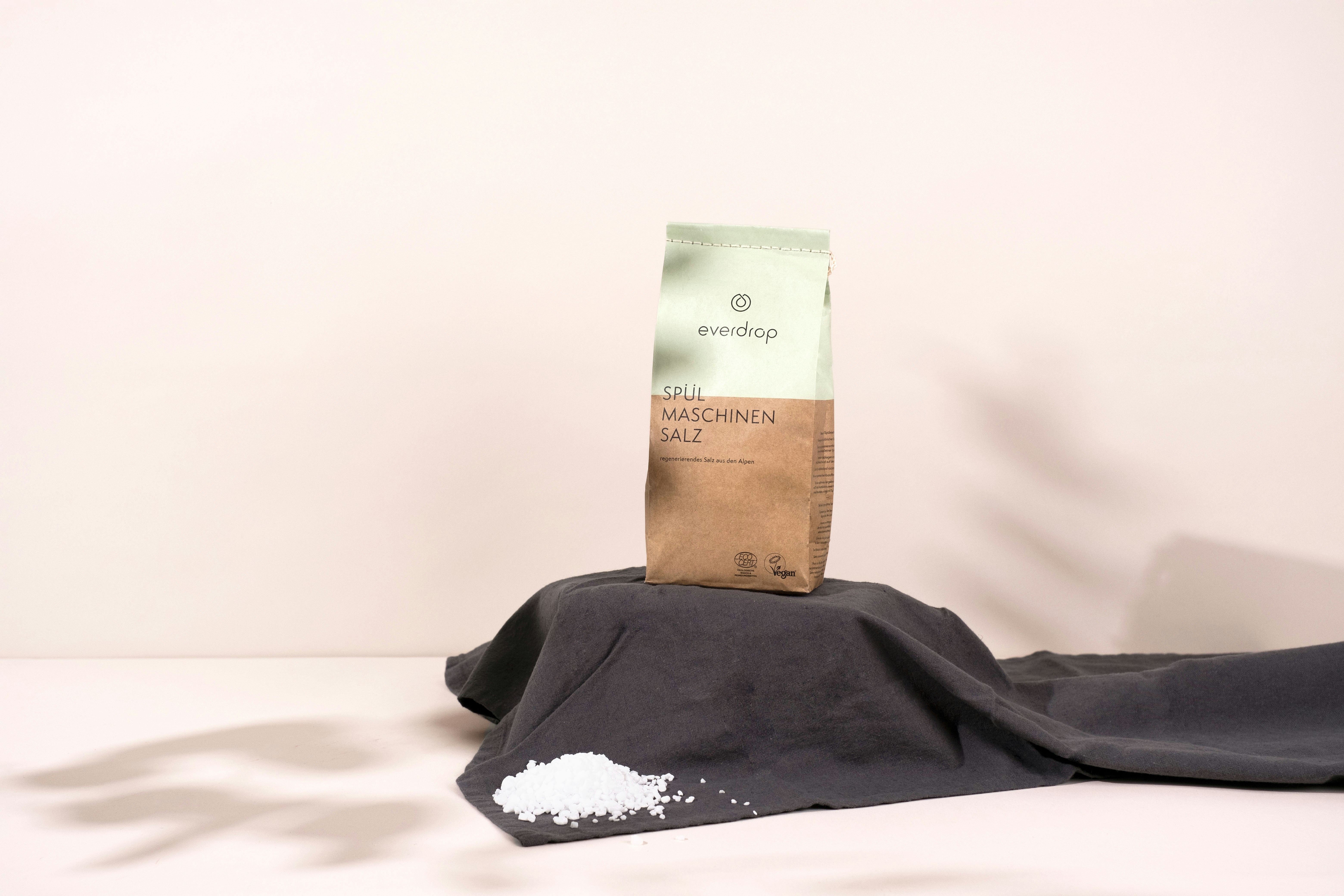 a paper bag sitting on top of a black cloth