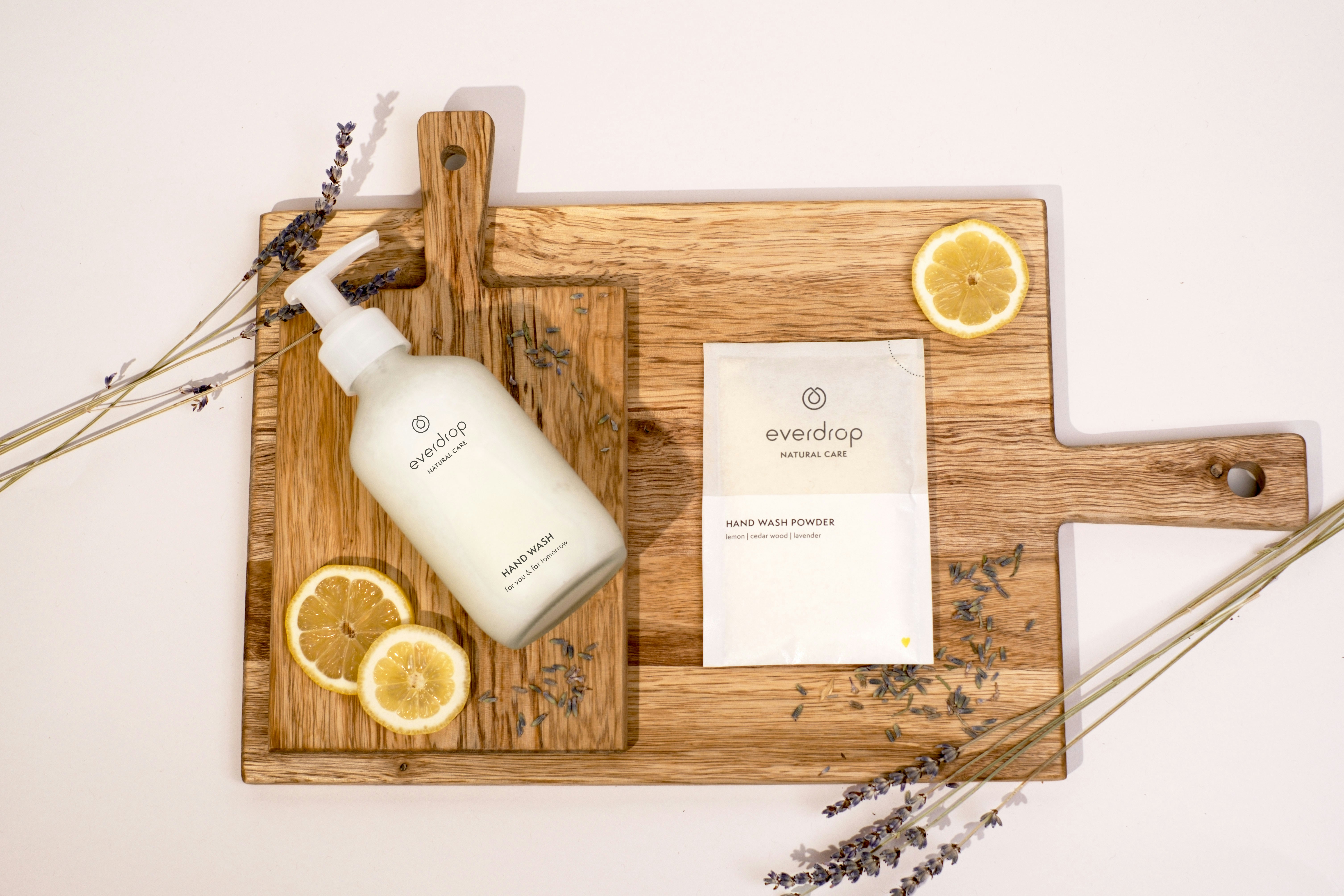 a bottle of lotion sitting on top of a cutting board