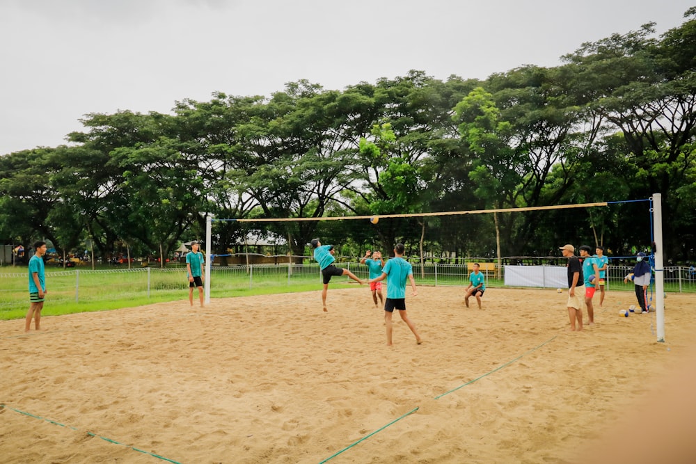 a group of people playing a game of volleyball