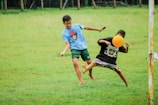 a couple of young men playing a game of frisbee