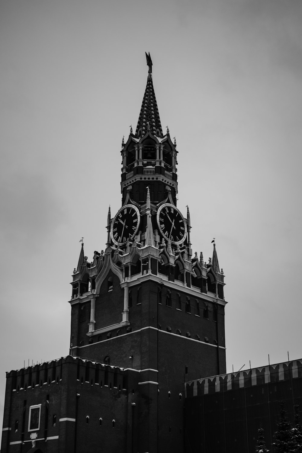 a black and white photo of a clock tower