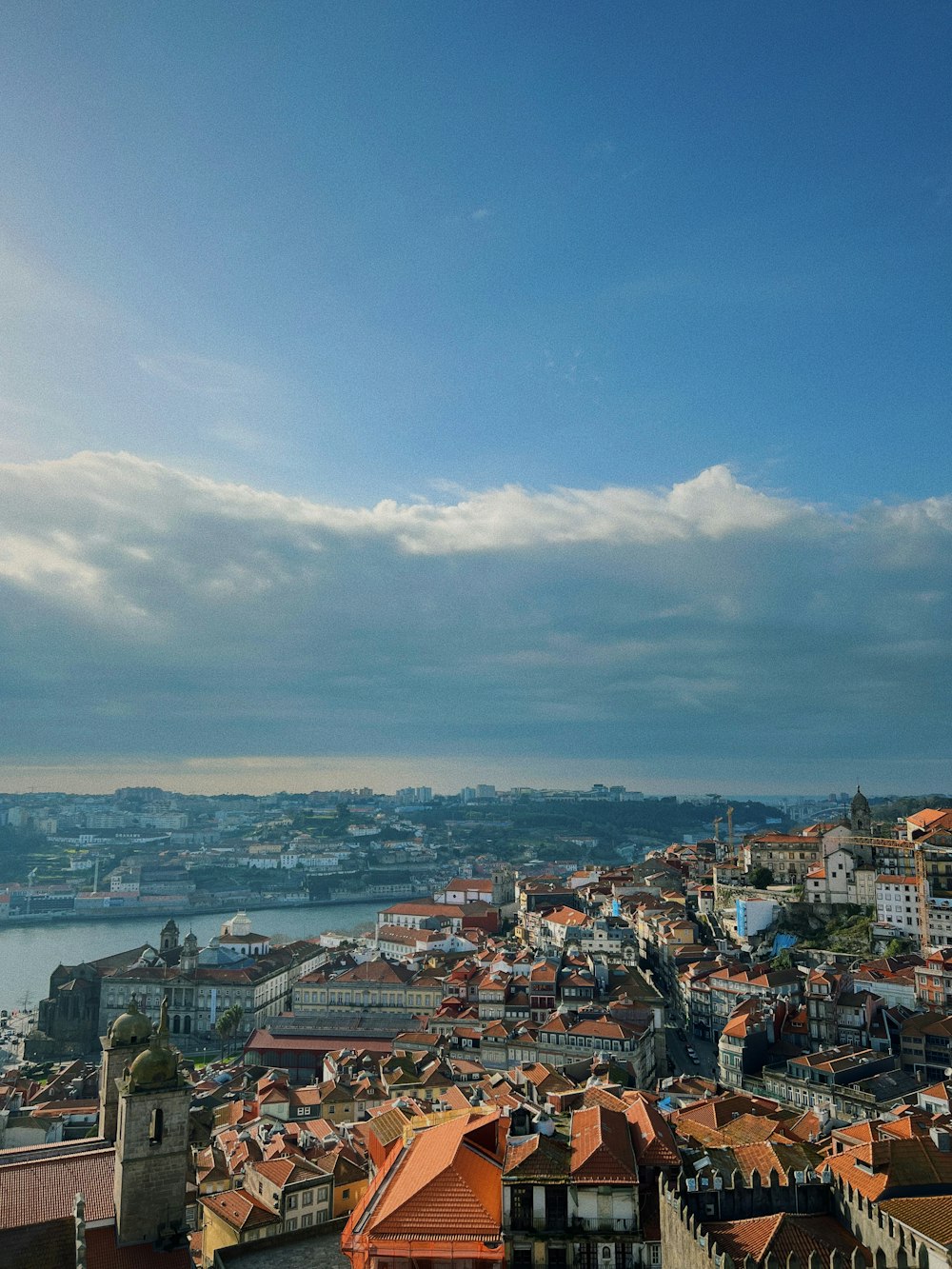 a bird's eye view of a city and a body of water