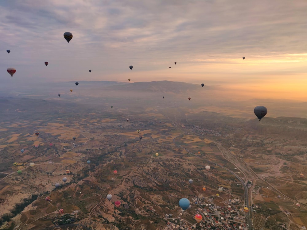 a bunch of hot air balloons flying in the sky