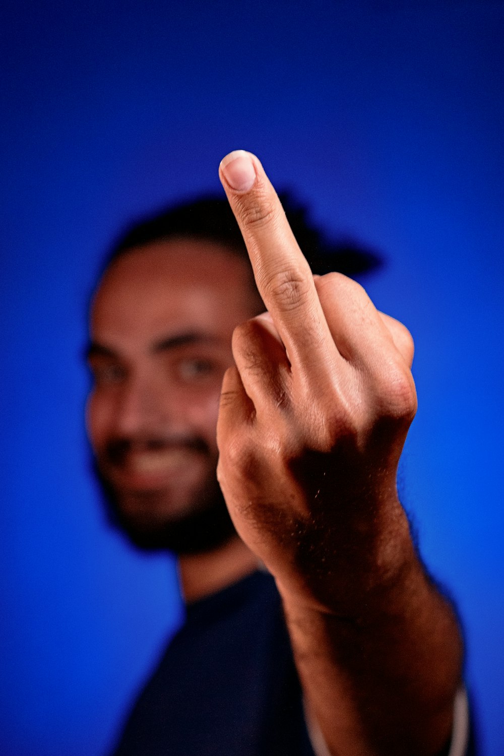a man making a hand sign with his fingers