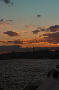 A scenic view of a popular dziriya landmark at sunset, glowing warmly.