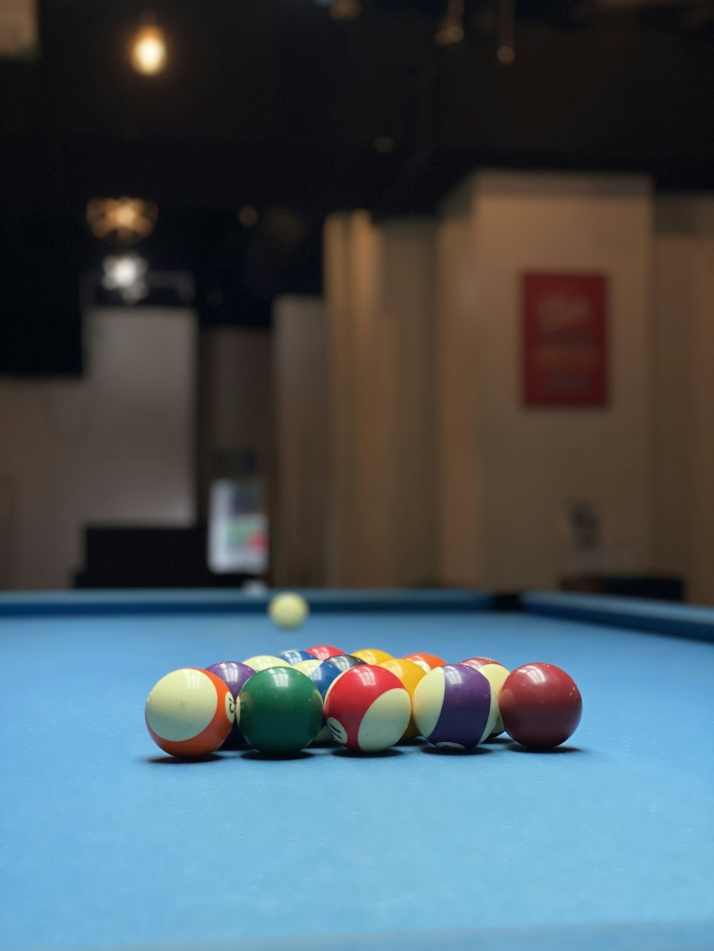 a pool table with a bunch of pool balls on it