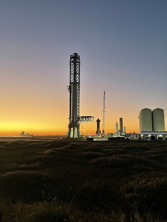 A sleek, modern rocket launching upward against a futuristic city skyline at dusk.