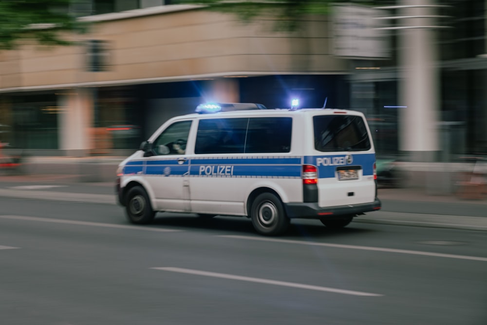 a police van driving down a city street