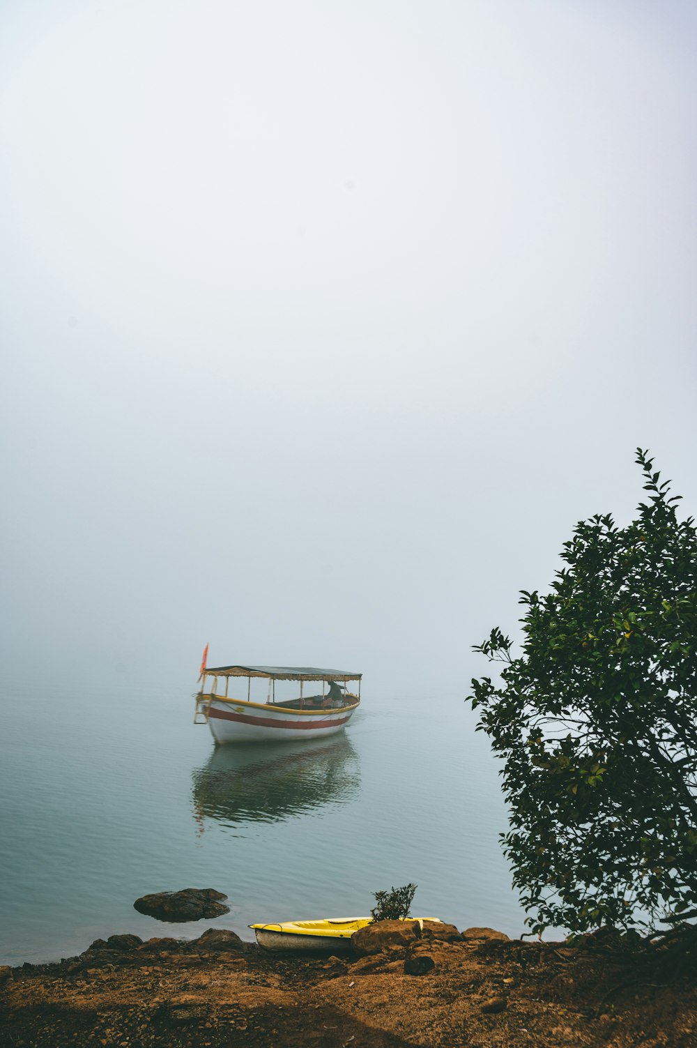 a boat floating on top of a body of water