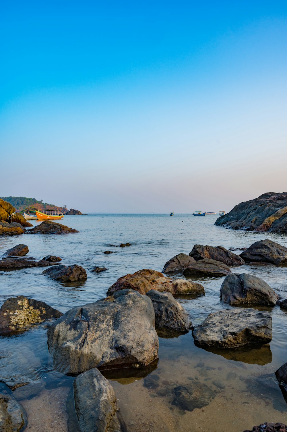 a body of water surrounded by large rocks