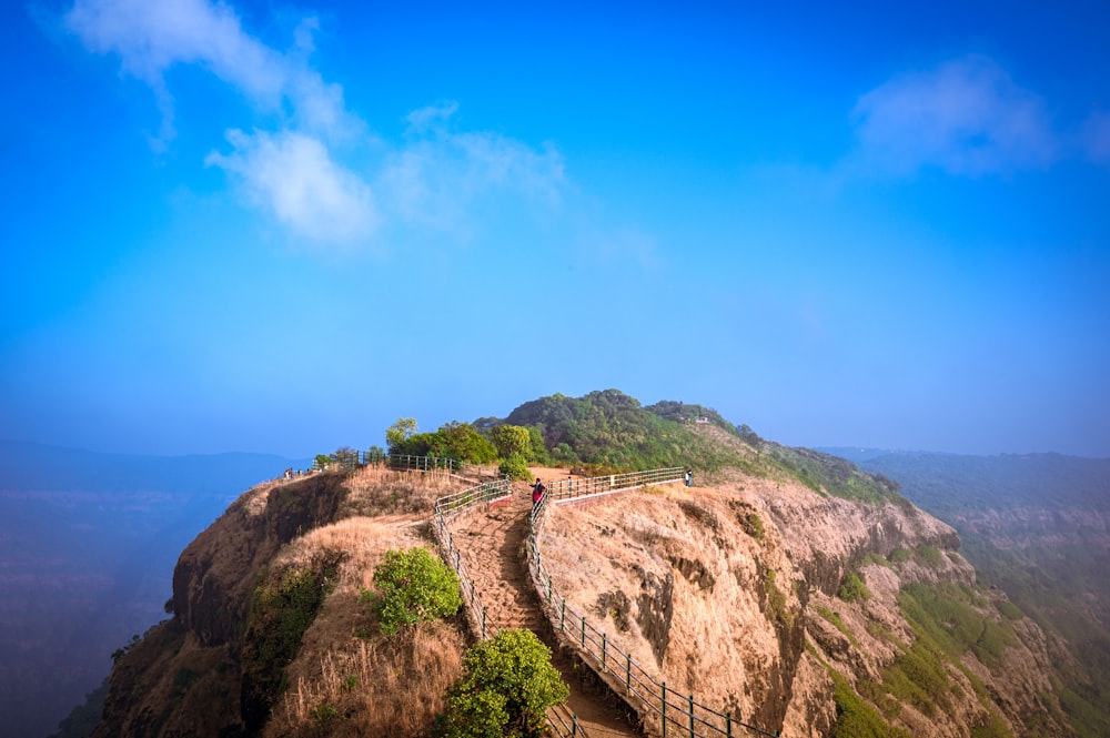 a long wooden walkway on top of a mountain