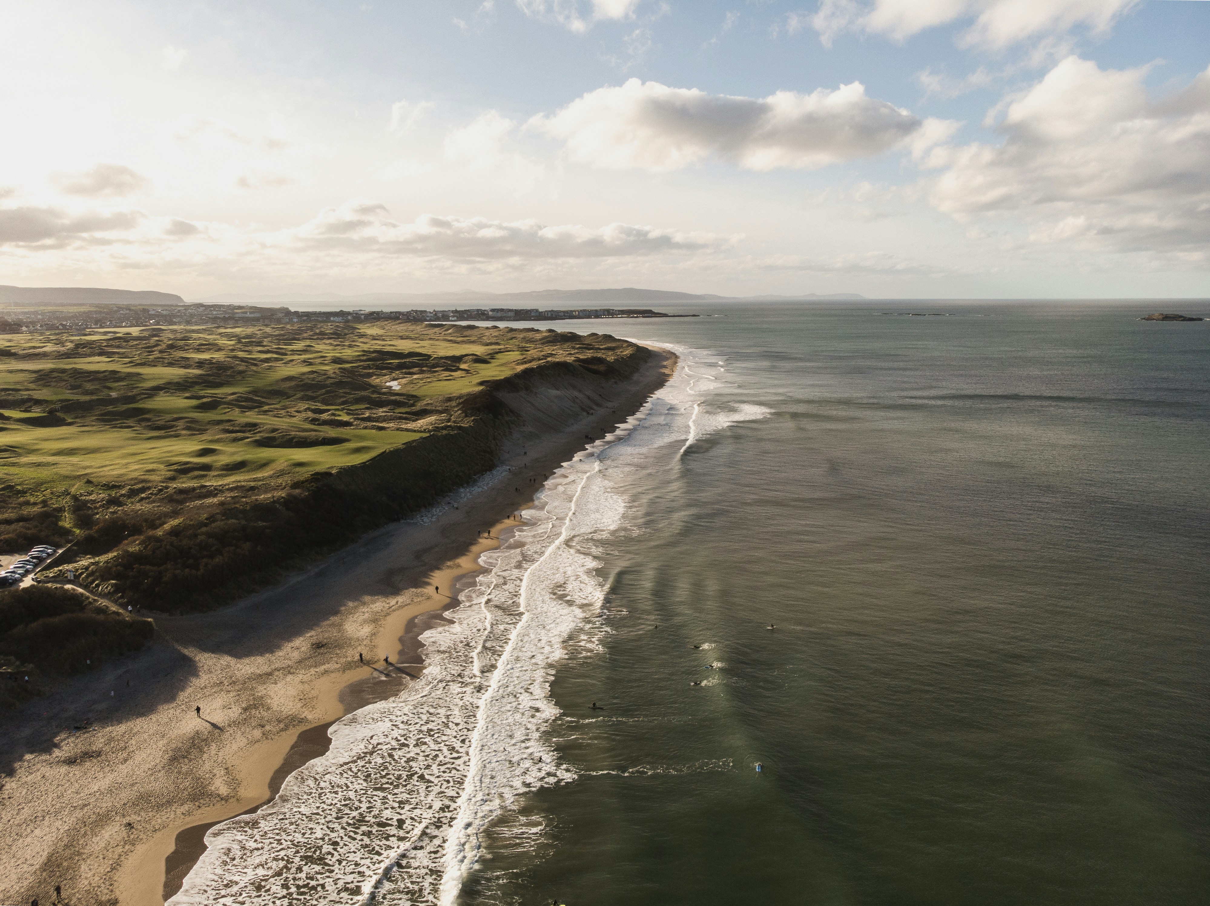 an aerial view of a beach and ocean