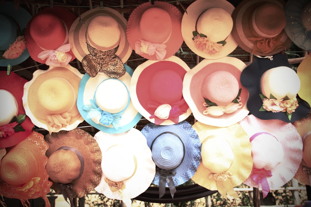 a bunch of hats that are on a rack