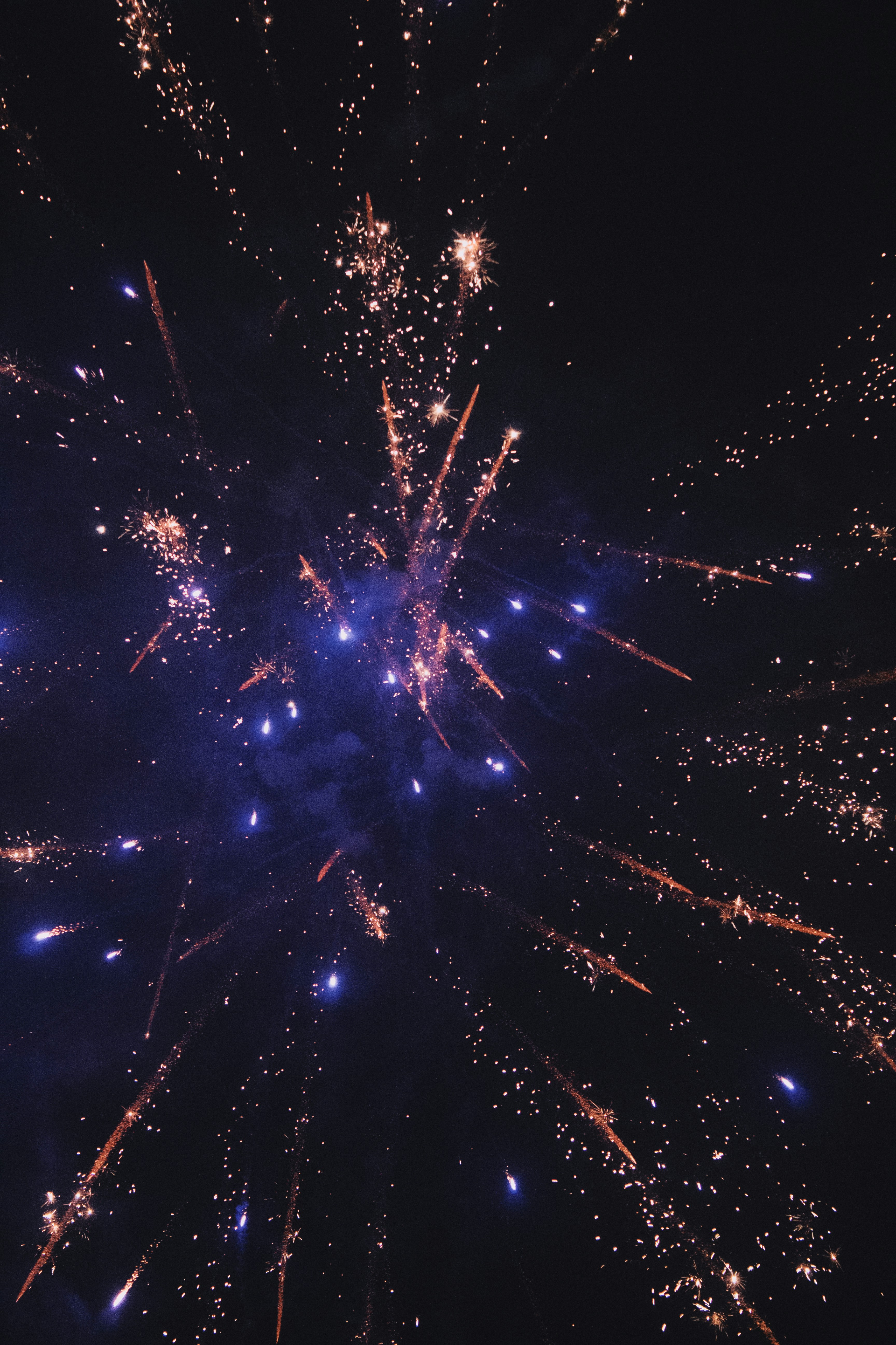 a bunch of fireworks are lit up in the night sky