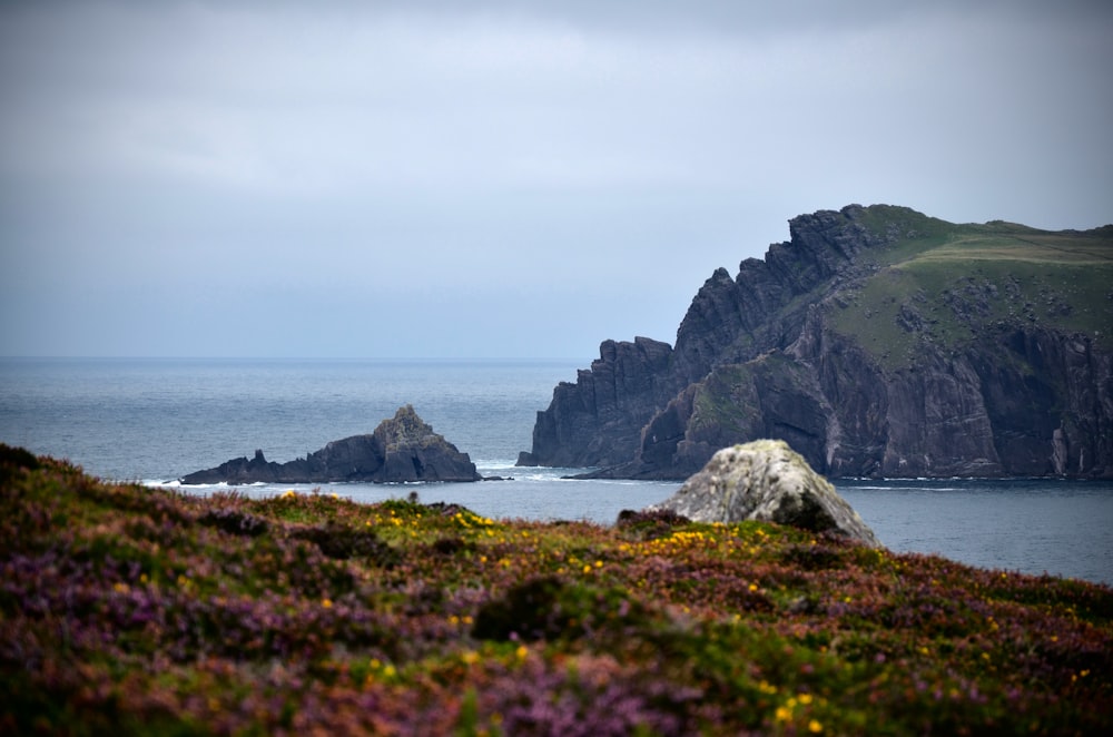 a rock outcropping in the middle of the ocean