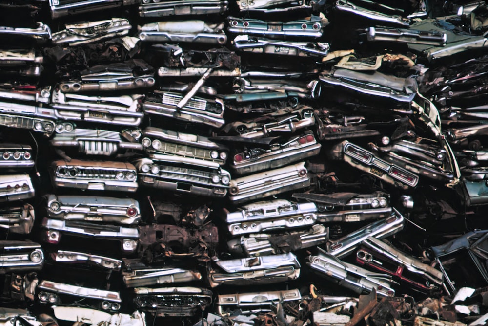 a pile of old cars sitting next to each other