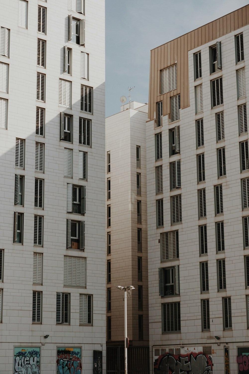 a couple of tall buildings sitting next to each other