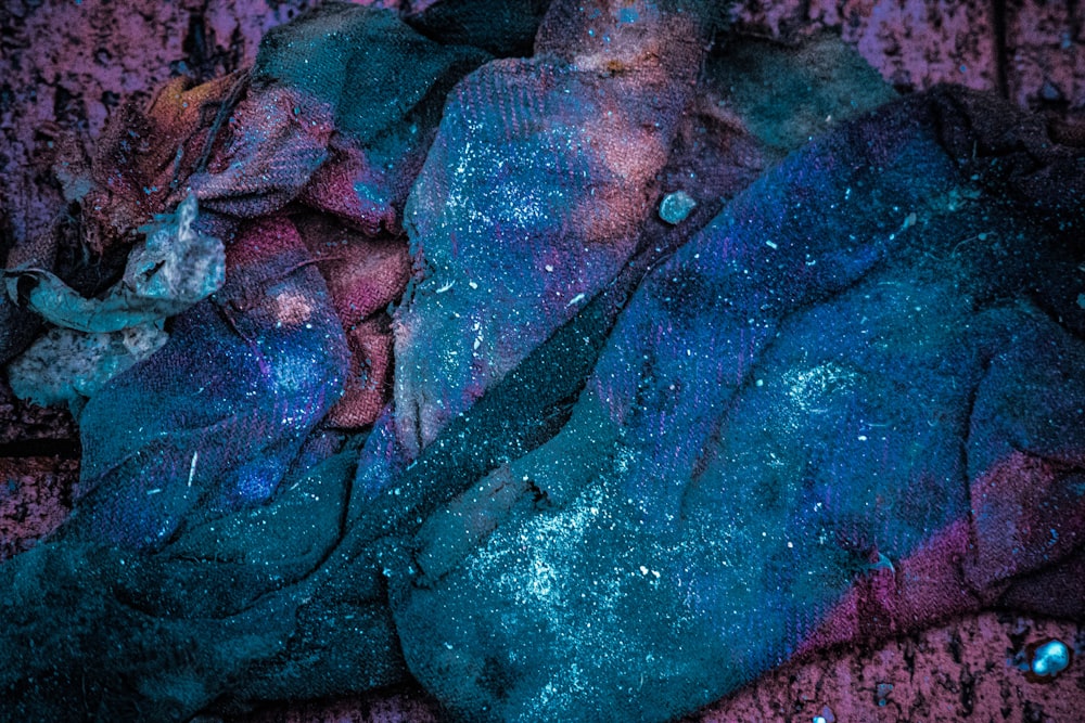 a blue and purple substance on a purple surface