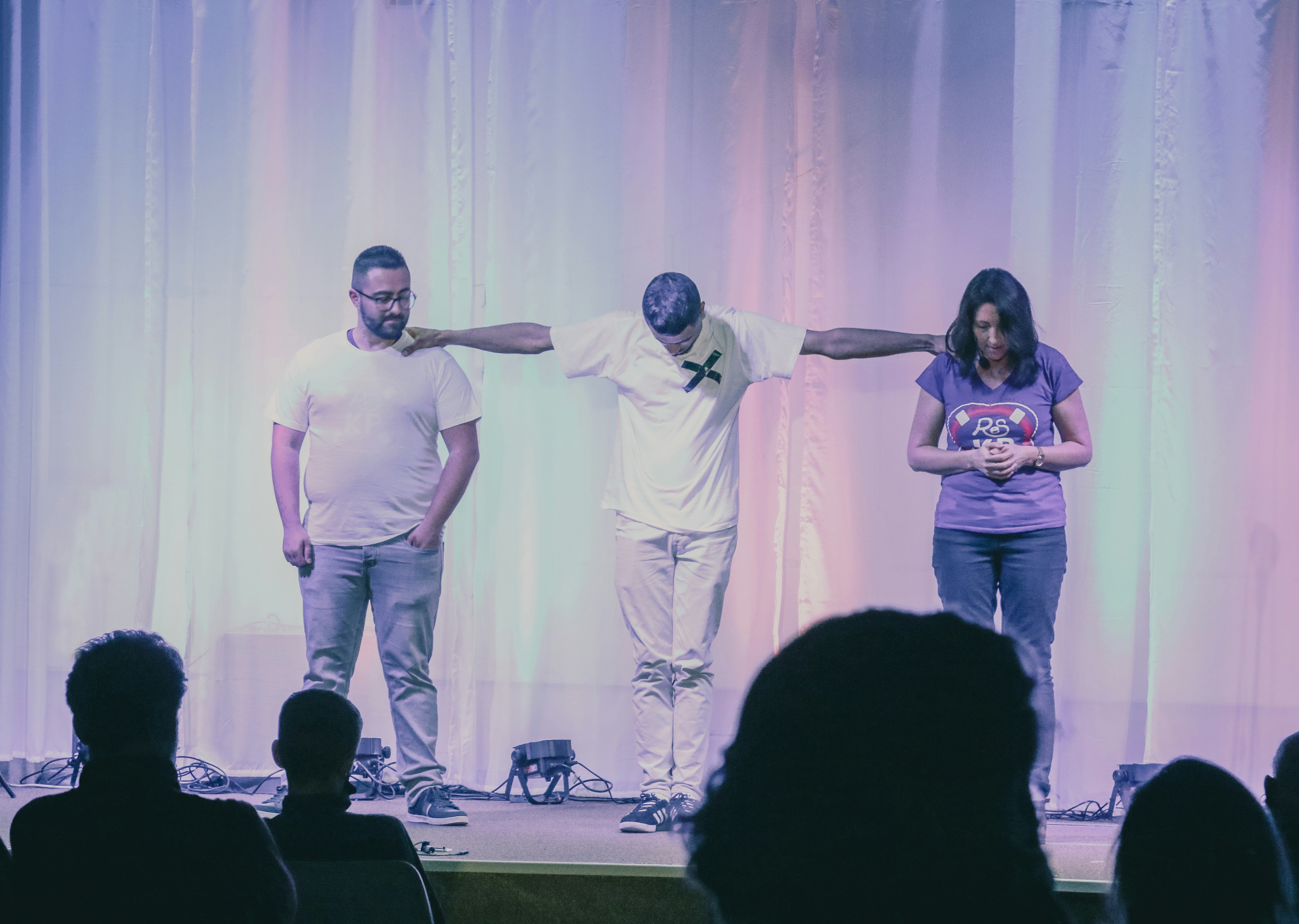 a group of people standing on top of a stage