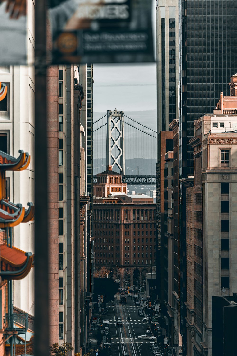 a view of a city with a bridge in the background