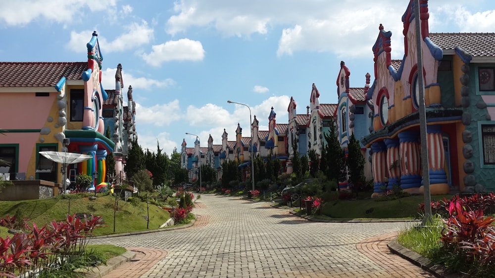 a cobblestone street lined with colorful houses