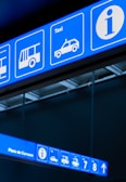 a blue and white sign that is on a wall
