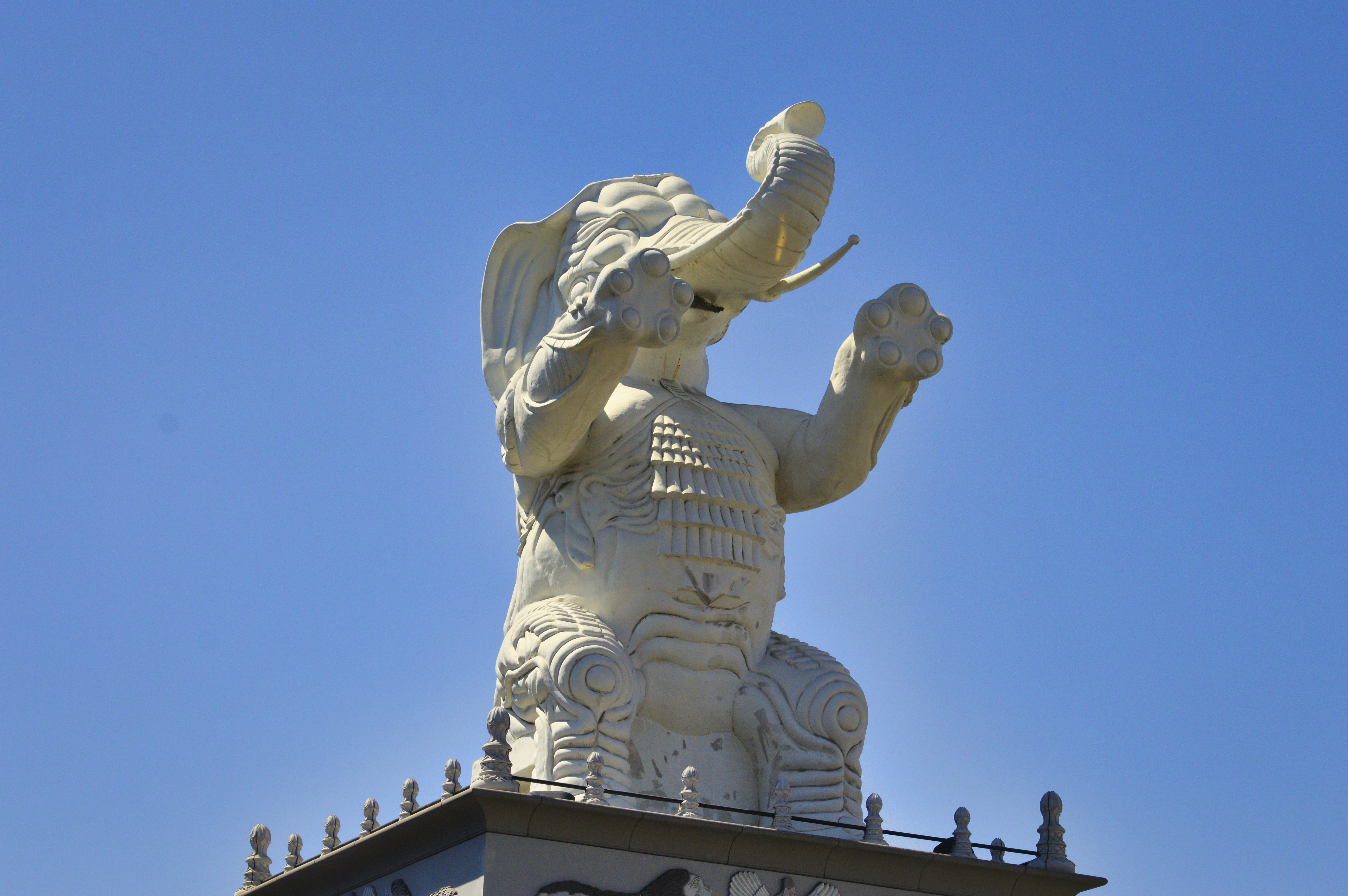 a statue of an elephant on top of a building