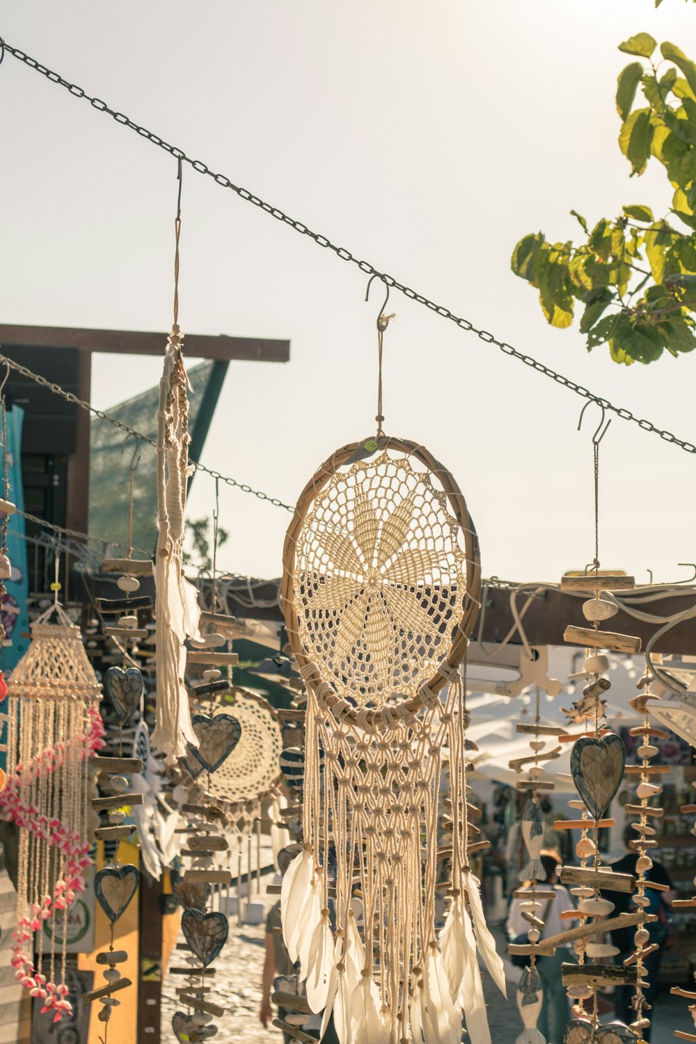 a group of hanging dream catchers in a market