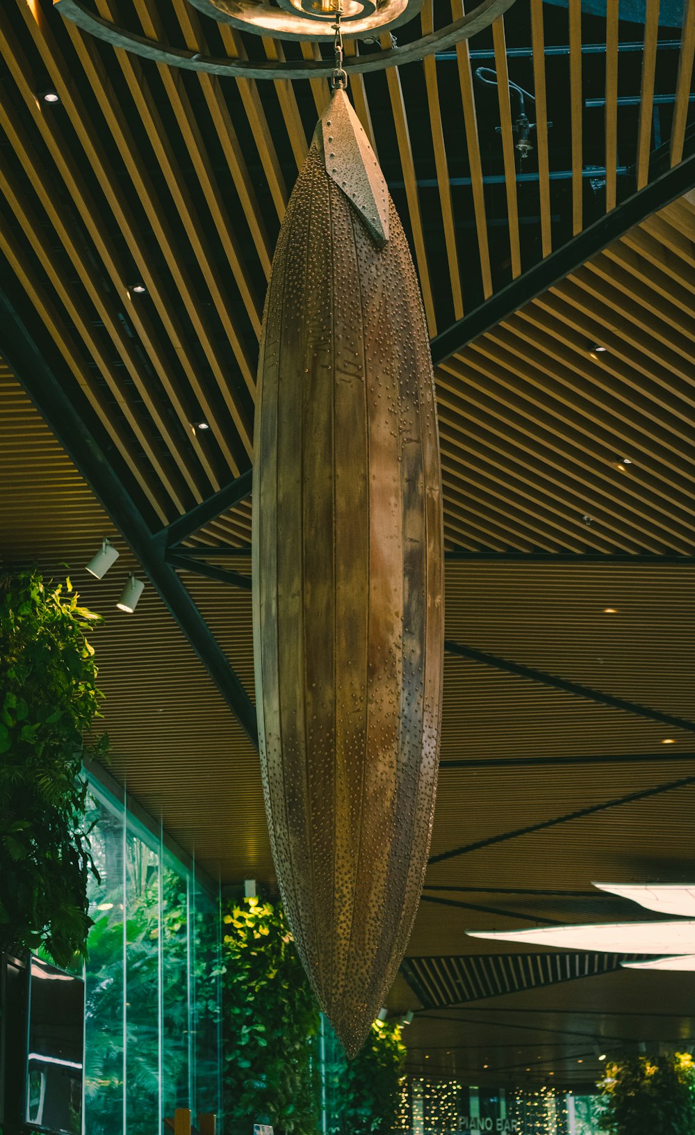 a surfboard hanging from the ceiling of a building