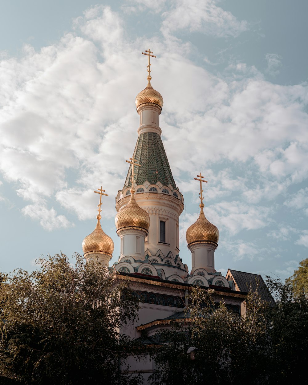 a church steeple with crosses on top of it