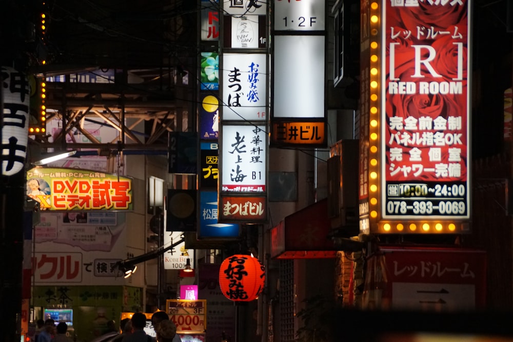 a city street filled with lots of neon signs