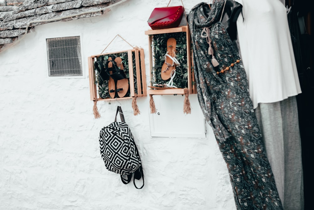 a white house with a black and white bag hanging on the wall