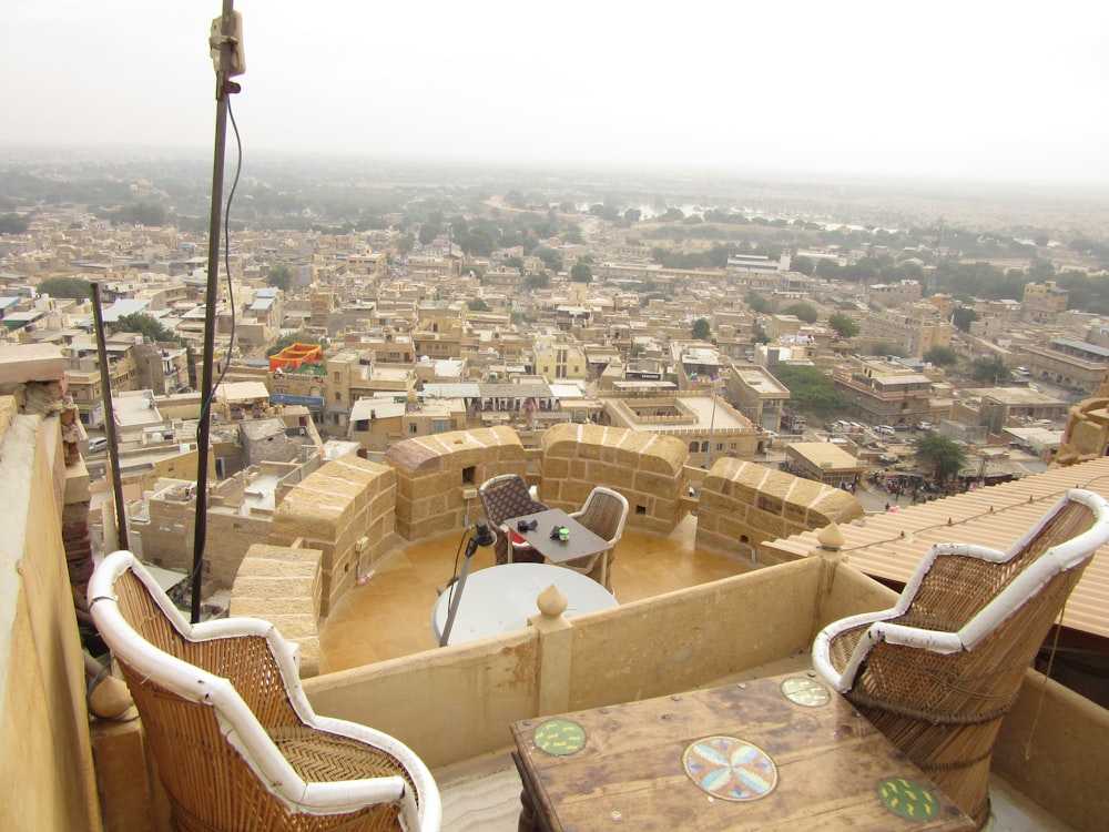 a view of a city from a rooftop restaurant